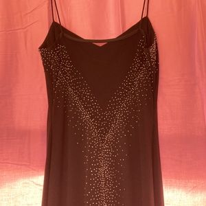 Spaghetti strap black prom dress.